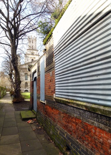 The side of the ruin, looking towards St George in the East church.