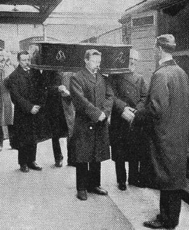 A coffin being loaded onto one of the Necropolis Railway carriages. 